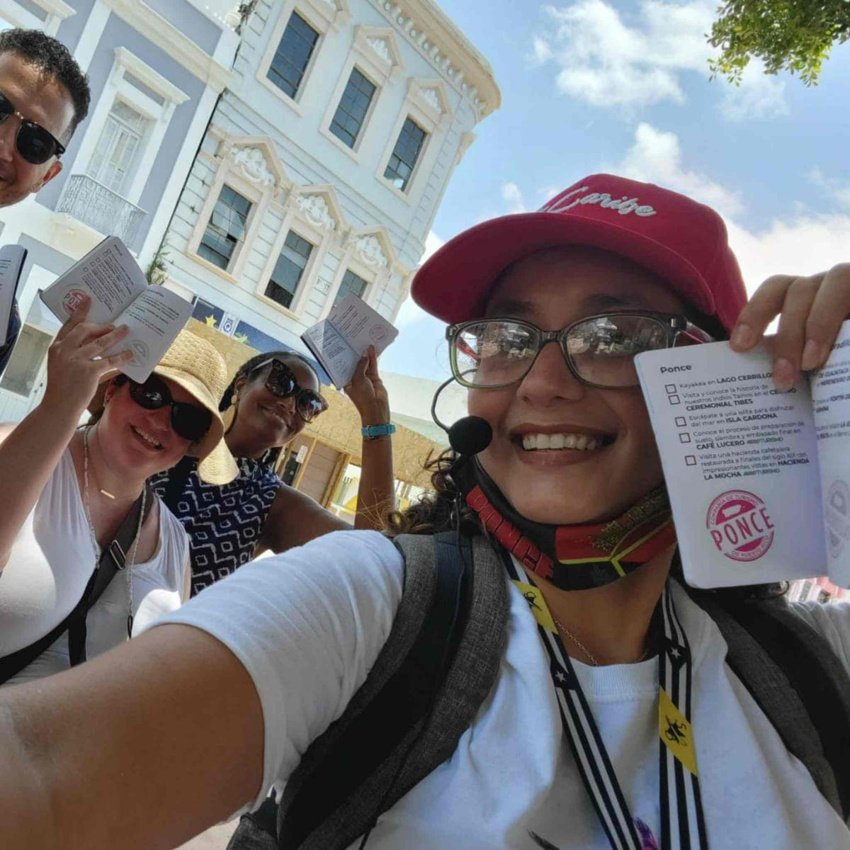 Tour guide Norymar Maldonado with tourists visiting Ponce.